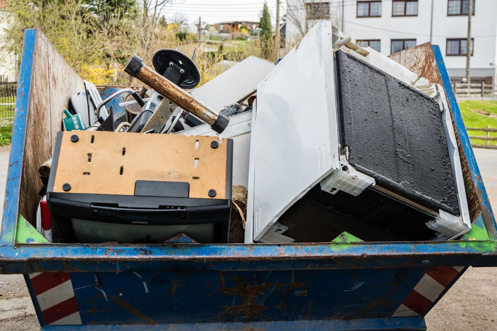 Junk removal, Brooklyn, NY - crew loading old couch into truck